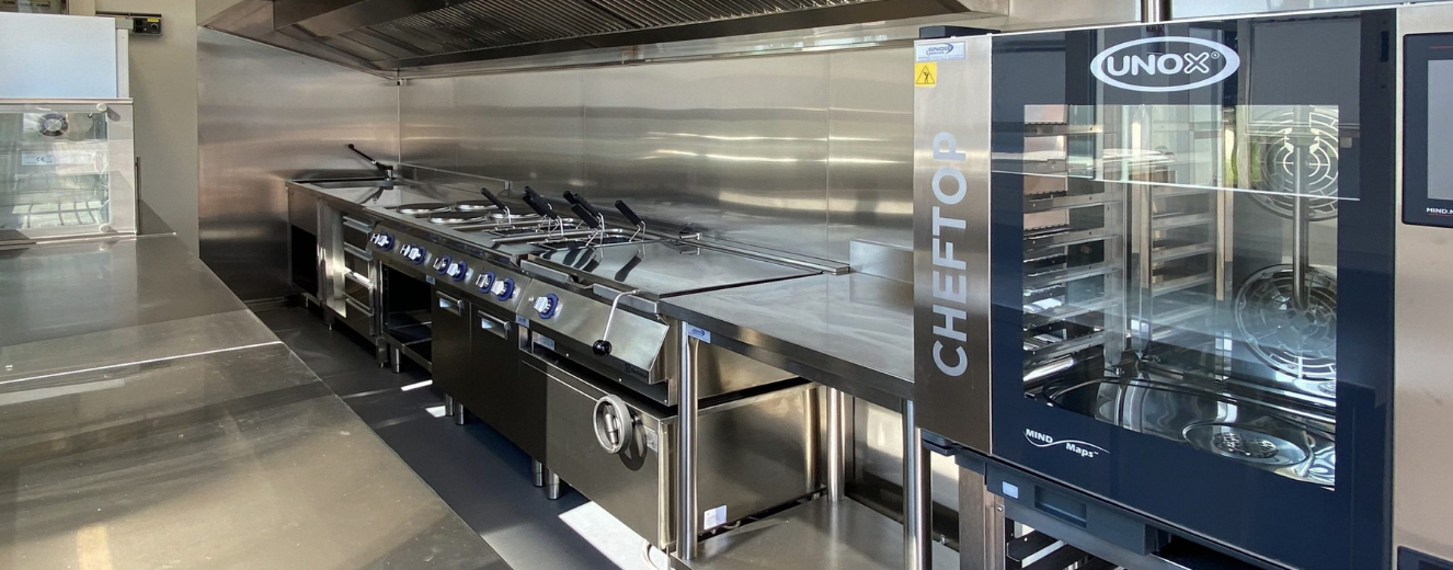 Stainless steel kitchen equipment featuring multiple cooking stations and a Cheftop branding on the side.