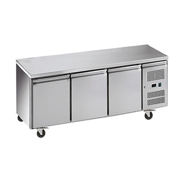 Stainless steel three-door bench chiller with wheels and a control panel on the side.