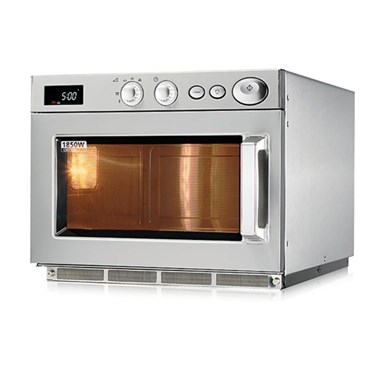 Stainless steel microwave oven with a glass door, displaying warm light from inside.