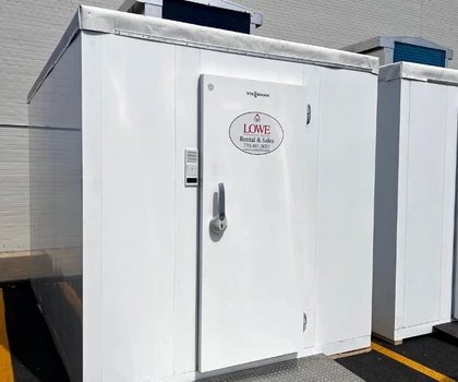 White storage unit with a door, featuring a sign that reads "LIME" in red.