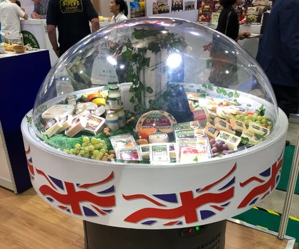 Display of British food products under a clear dome, surrounded by a Union Jack design.