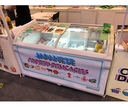 Display freezer showcasing various frozen delicacies with a colourful sign reading "Japanese Frozen Delicacies.