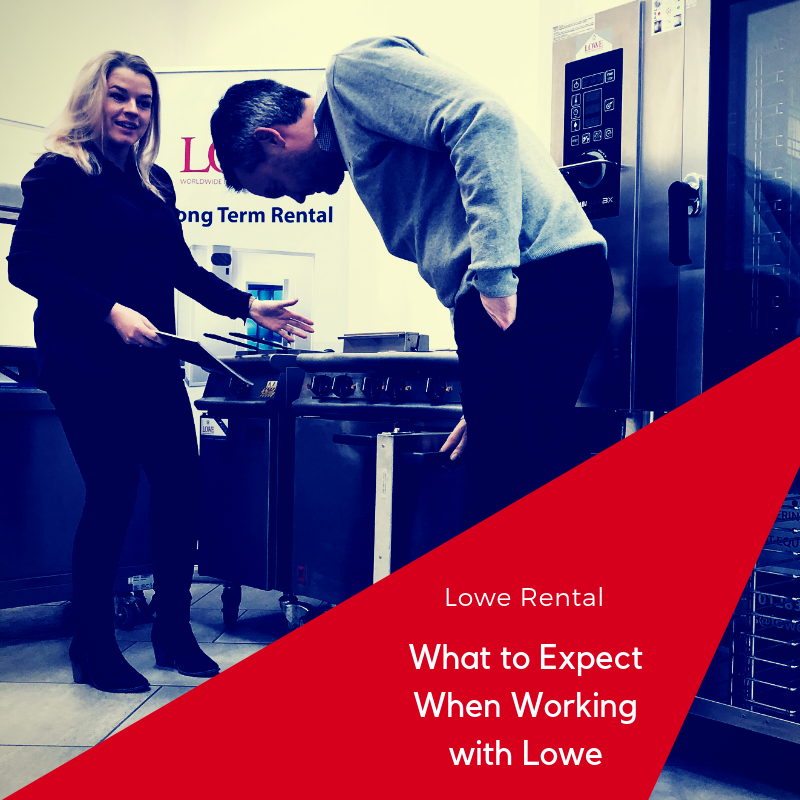 A woman in black assists a man in grey near kitchen equipment, with a red graphic overlay.