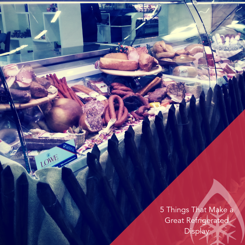 Refrigerated display showcasing various meats, with a glossy surface and vibrant colours.