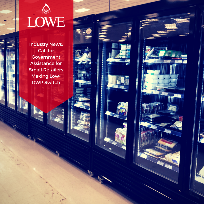 Black glass display refrigerators filled with products, featuring a red banner announcing government assistance for small retailers.