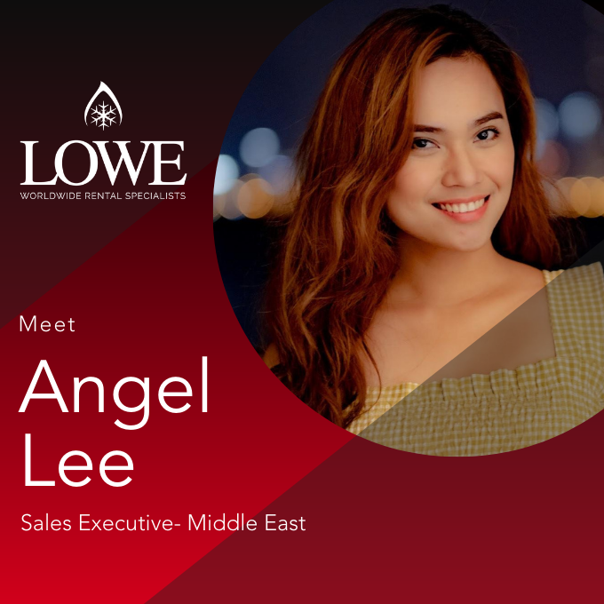 Angel Lee, Sales Executive for the Middle East, smiles against a blurred city background.