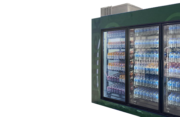 A green vending machine displaying various drinks, including water and soft drinks, in a sports setting.