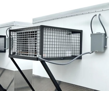 Walk-in cooler with a black metal mesh exterior and grey control box, set against a white background.