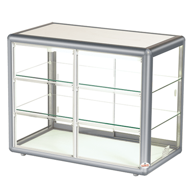 Silver self-serve countertop display with glass shelves and a sleek, modern design.