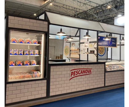 Pescanova exhibition stand featuring white tiled walls, illuminated displays, and various seafood products.
