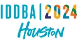 IDDBA 2024 logo featuring vibrant colours, prominently displaying "Houston" in teal script.